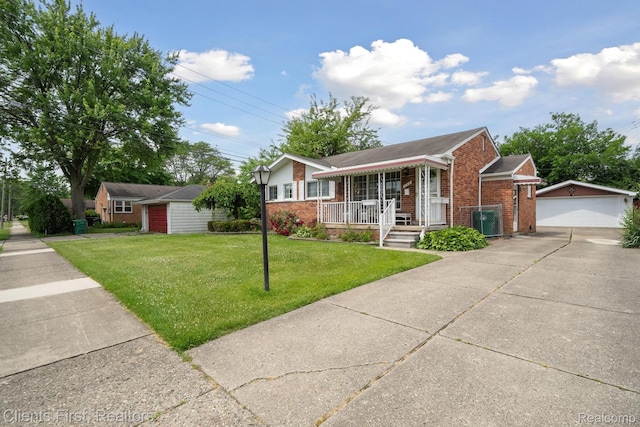 939 Deering St, Garden City, MI 48135 - single story home with brick siding, an outdoor structure, covered porch, a garage, and a front yard
