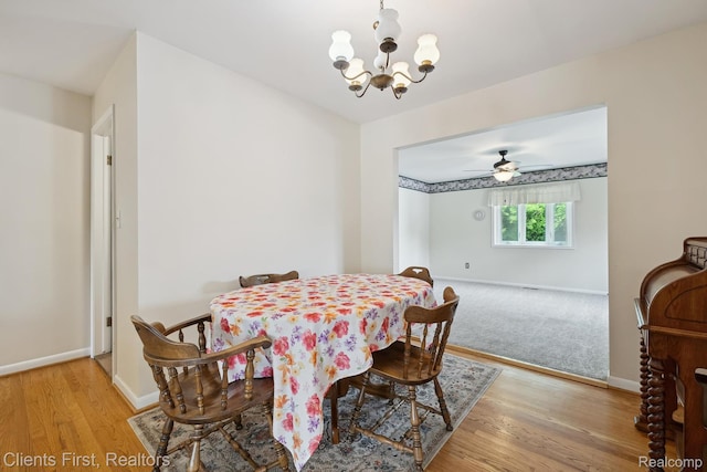 939 Deering St, Garden City, MI 48135 - dining room featuring a chandelier, light wood-style flooring, and a ceiling fan