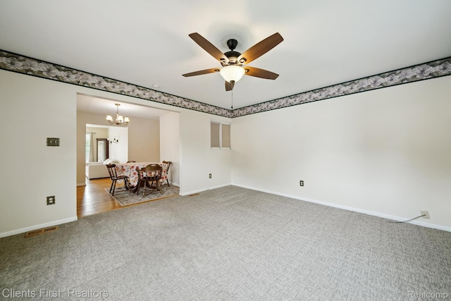 939 Deering St, Garden City, MI 48135 - carpeted empty room featuring a chandelier and a ceiling fan