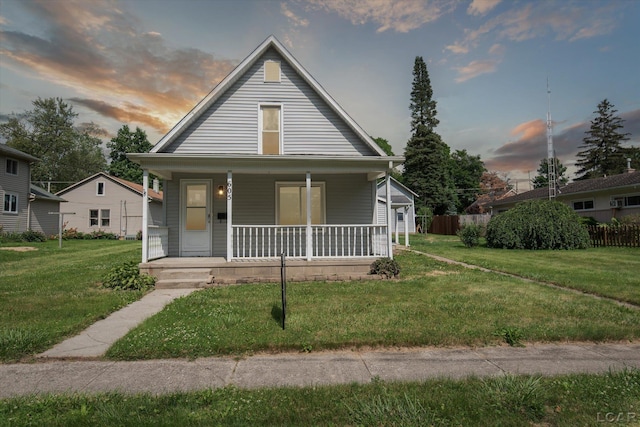 605 Oak St, Hudson, MI 49247 - bungalow-style house featuring covered porch and a yard