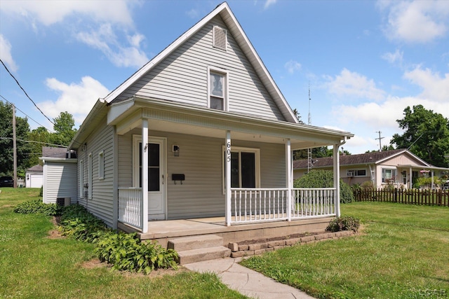 605 Oak St, Hudson, MI 49247 - bungalow-style house featuring a porch and a front lawn