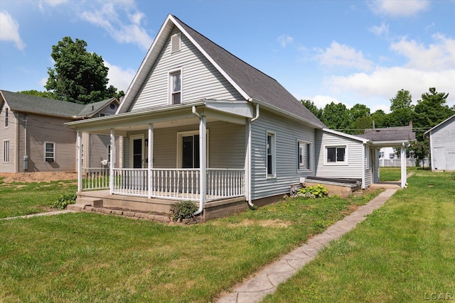 605 Oak St, Hudson, MI 49247 - view of front of home with covered porch and a front yard