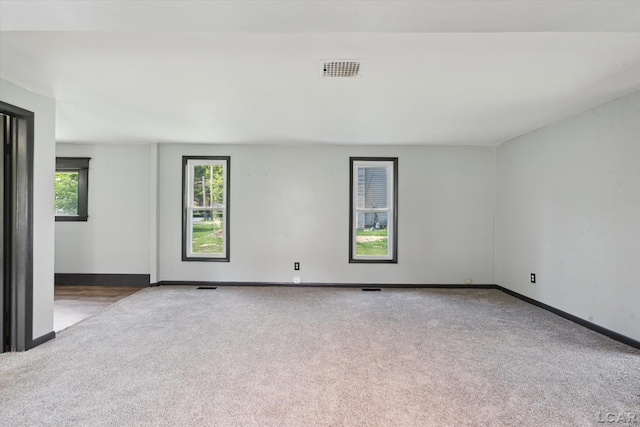 605 Oak St, Hudson, MI 49247 - spare room featuring carpet flooring and baseboards