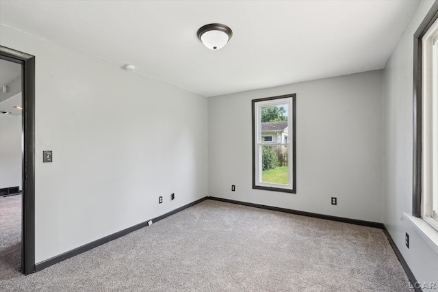 605 Oak St, Hudson, MI 49247 - carpeted spare room featuring baseboards