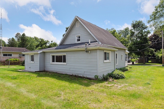 605 Oak St, Hudson, MI 49247 - back of house featuring a shingled roof