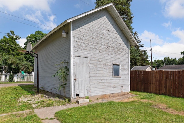 605 Oak St, Hudson, MI 49247 - view of property exterior with an outdoor structure