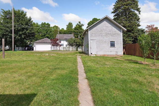 605 Oak St, Hudson, MI 49247 - view of yard with a detached garage
