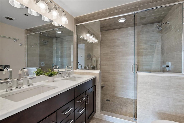 43 Campau Cir NW, Grand Rapids, MI 49503 - full bathroom featuring double vanity and a stall shower