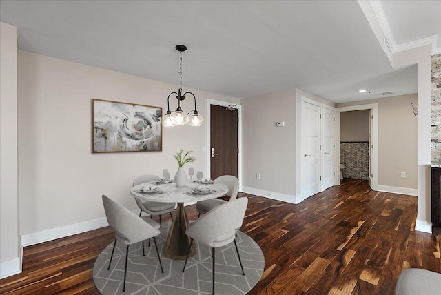 43 Campau Cir NW, Grand Rapids, MI 49503 - dining area featuring dark wood-style flooring, a chandelier, ornamental molding, and recessed lighting