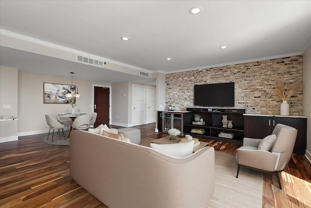 43 Campau Cir NW, Grand Rapids, MI 49503 - living room featuring crown molding, wood finished floors, recessed lighting, and a chandelier