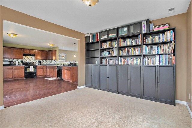 8855 Geiser Grv, Richland, MI 49083 - interior space with dark colored carpet and baseboards