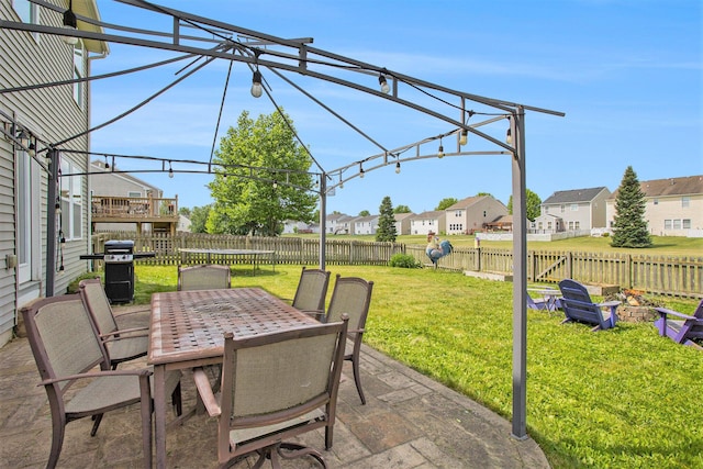 8855 Geiser Grv, Richland, MI 49083 - fenced backyard with outdoor dining space, a residential view, a patio area, area for grilling, and a trampoline