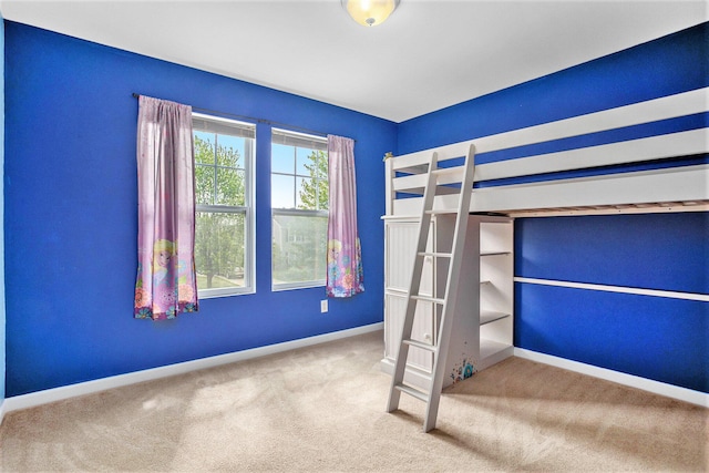 8855 Geiser Grv, Richland, MI 49083 - unfurnished bedroom featuring baseboards and carpet flooring