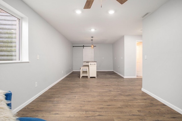8855 Geiser Grv, Richland, MI 49083 - unfurnished living room with a barn door, recessed lighting, ceiling fan, and dark wood finished floors