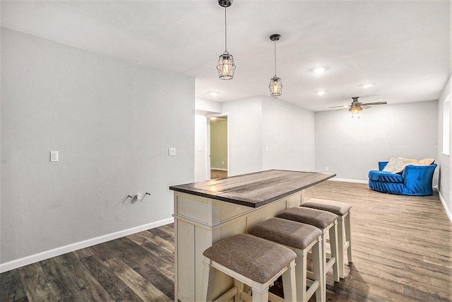 8855 Geiser Grv, Richland, MI 49083 - kitchen featuring dark wood-style flooring, pendant lighting, and open floor plan