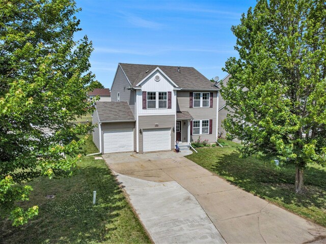 8855 Geiser Grv, Richland, MI 49083 - traditional-style house with concrete driveway, a shingled roof, and a front lawn