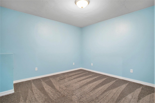 8855 Geiser Grv, Richland, MI 49083 - empty room featuring dark carpet and baseboards