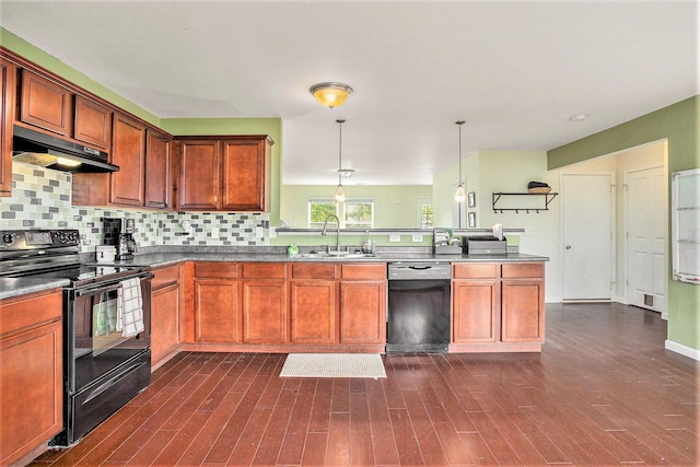 8855 Geiser Grv, Richland, MI 49083 - kitchen featuring black appliances, under cabinet range hood, a peninsula, backsplash, and decorative light fixtures