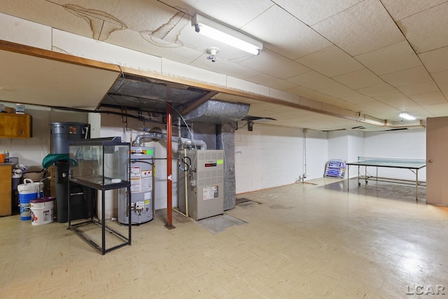1043 Orchard Rd, Adrian, MI 49221 - unfinished below grade area with water heater, tile patterned floors, and heating unit