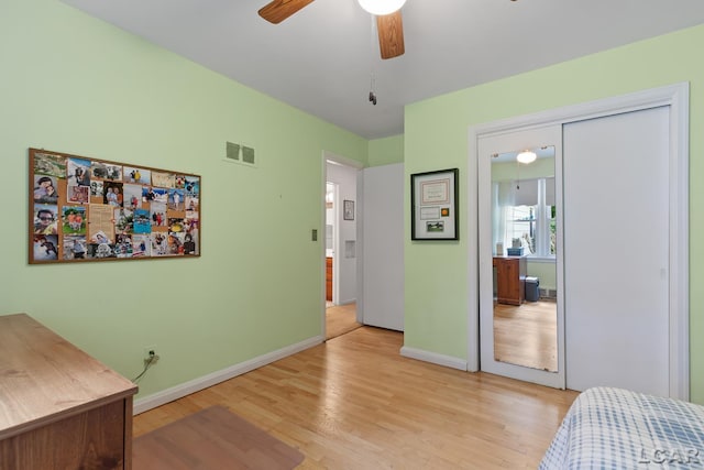 1043 Orchard Rd, Adrian, MI 49221 - bedroom featuring light wood finished floors, a closet, and a ceiling fan