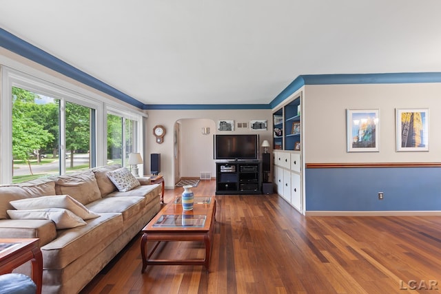 1043 Orchard Rd, Adrian, MI 49221 - living area featuring arched walkways and wood-type flooring