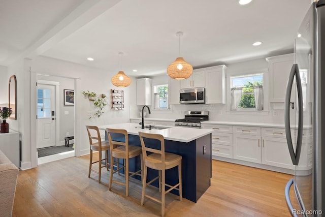 423 N Altadena Ave, Royal Oak, MI 48067 - kitchen with stainless steel appliances, healthy amount of natural light, light countertops, an island with sink, and recessed lighting