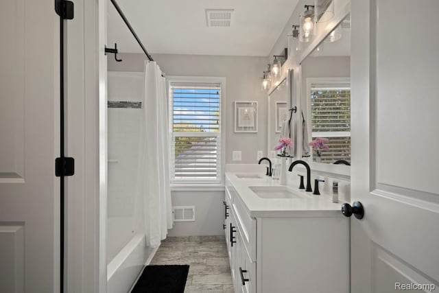 423 N Altadena Ave, Royal Oak, MI 48067 - bathroom featuring double vanity, shower / tub combo, and wood finished floors