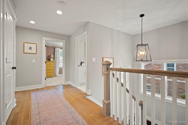 423 N Altadena Ave, Royal Oak, MI 48067 - hall with a chandelier, light wood finished floors, an upstairs landing, and recessed lighting