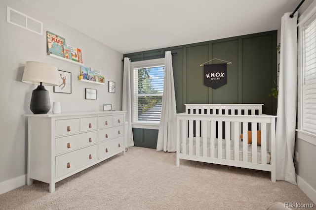 423 N Altadena Ave, Royal Oak, MI 48067 - bedroom featuring light carpet and a crib
