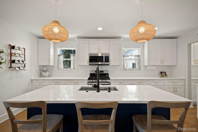 423 N Altadena Ave, Royal Oak, MI 48067 - kitchen featuring appliances with stainless steel finishes, decorative backsplash, recessed lighting, plenty of natural light, and white cabinetry