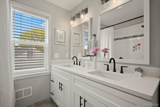 423 N Altadena Ave, Royal Oak, MI 48067 - bathroom with plenty of natural light, double vanity, and a tile shower