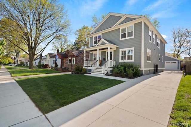 423 N Altadena Ave, Royal Oak, MI 48067 - american foursquare style home featuring covered porch, a front yard, an outdoor structure, and a garage