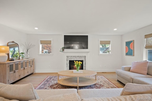 423 N Altadena Ave, Royal Oak, MI 48067 - living room featuring a lit fireplace, recessed lighting, and light wood-style floors