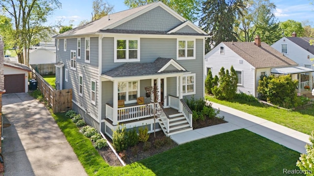 423 N Altadena Ave, Royal Oak, MI 48067 - view of front facade with covered porch, roof with shingles, an outbuilding, and a garage