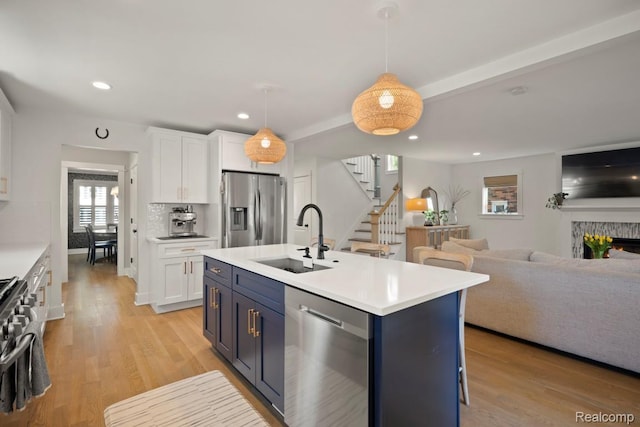 423 N Altadena Ave, Royal Oak, MI 48067 - kitchen with appliances with stainless steel finishes, white cabinets, open floor plan, blue cabinetry, and recessed lighting