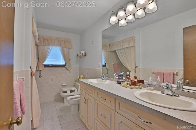 42471 Arcadia Dr, Sterling Heights, MI 48313 - full bath featuring a bidet, tile patterned flooring, tile walls, double vanity, and wainscoting