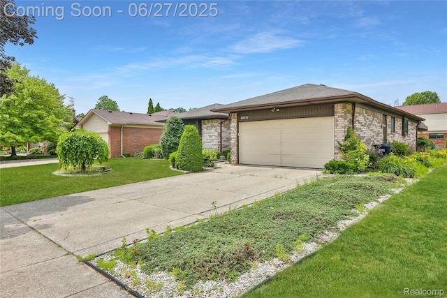 42471 Arcadia Dr, Sterling Heights, MI 48313 - view of front of property with a garage, driveway, brick siding, and a front yard