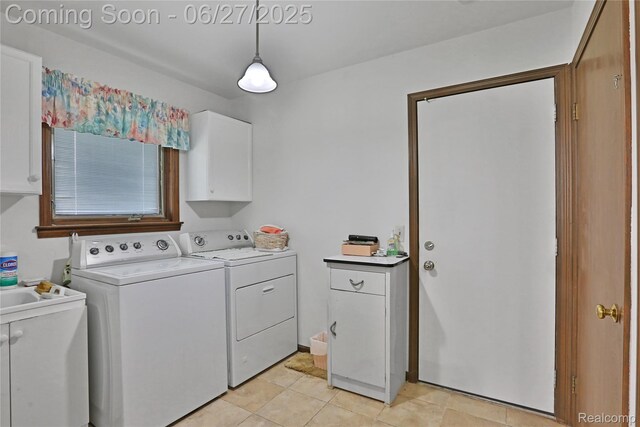 42471 Arcadia Dr, Sterling Heights, MI 48313 - laundry room featuring cabinet space, washing machine and dryer, and light tile patterned floors