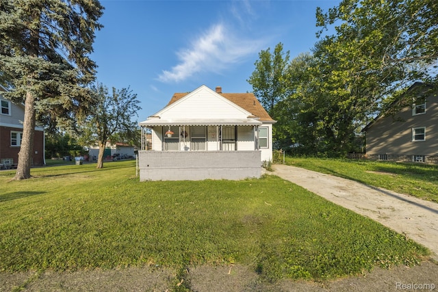 20258 Caldwell St, Detroit, MI 48234 - bungalow-style house with a front lawn and a chimney