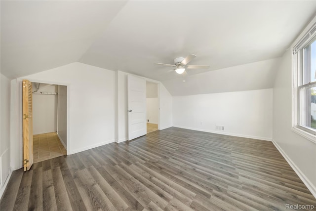 20258 Caldwell St, Detroit, MI 48234 - additional living space with a ceiling fan, lofted ceiling, dark wood-style flooring, and healthy amount of natural light