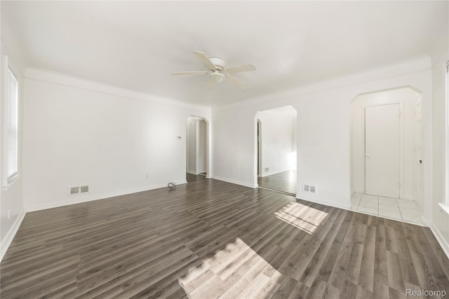 20258 Caldwell St, Detroit, MI 48234 - spare room with arched walkways, ceiling fan, and wood finished floors