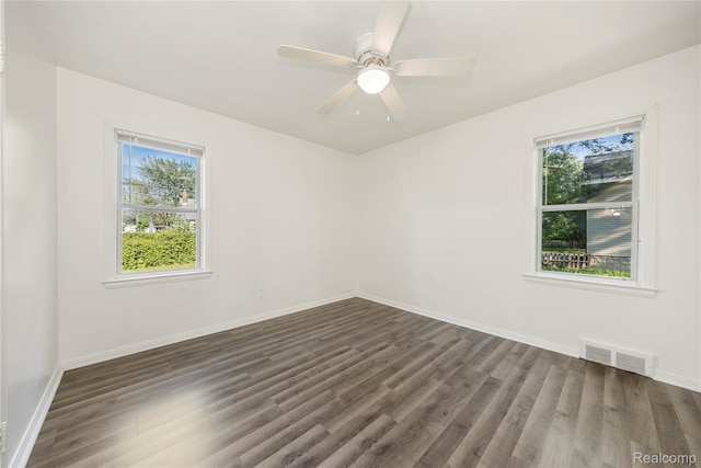 20258 Caldwell St, Detroit, MI 48234 - unfurnished room featuring plenty of natural light, dark wood-style floors, and a ceiling fan