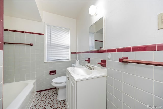 20258 Caldwell St, Detroit, MI 48234 - bathroom with tile walls, vanity, a tub to relax in, tile patterned floors, and wainscoting