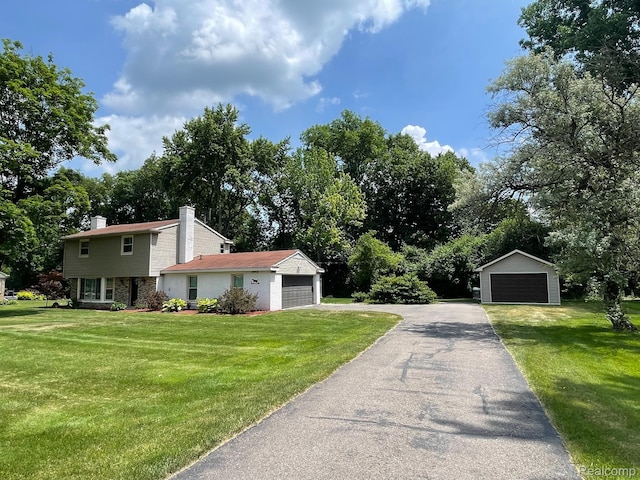 21150 E Chigwidden St, Northville, MI 48167 - view of property exterior featuring a chimney, a lawn, and a garage