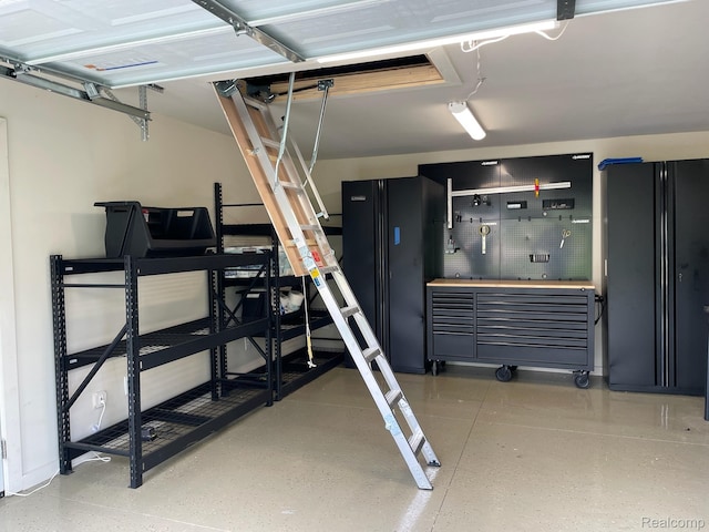 21150 E Chigwidden St, Northville, MI 48167 - garage featuring a workshop area