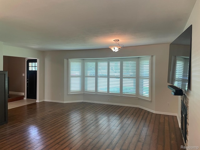 21150 E Chigwidden St, Northville, MI 48167 - unfurnished living room featuring dark wood-style floors