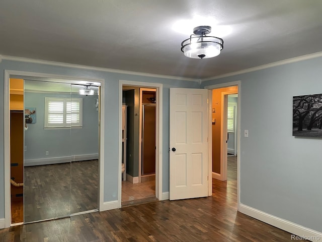 21150 E Chigwidden St, Northville, MI 48167 - unfurnished bedroom with crown molding and dark wood finished floors