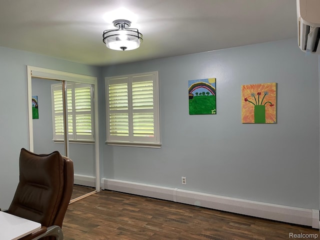 21150 E Chigwidden St, Northville, MI 48167 - unfurnished office with wood finished floors, a baseboard radiator, and a wall mounted air conditioner
