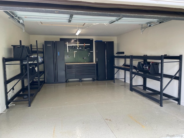 21150 E Chigwidden St, Northville, MI 48167 - garage with a workshop area and baseboards