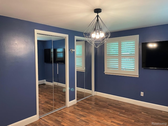 21150 E Chigwidden St, Northville, MI 48167 - empty room with a chandelier and wood finished floors